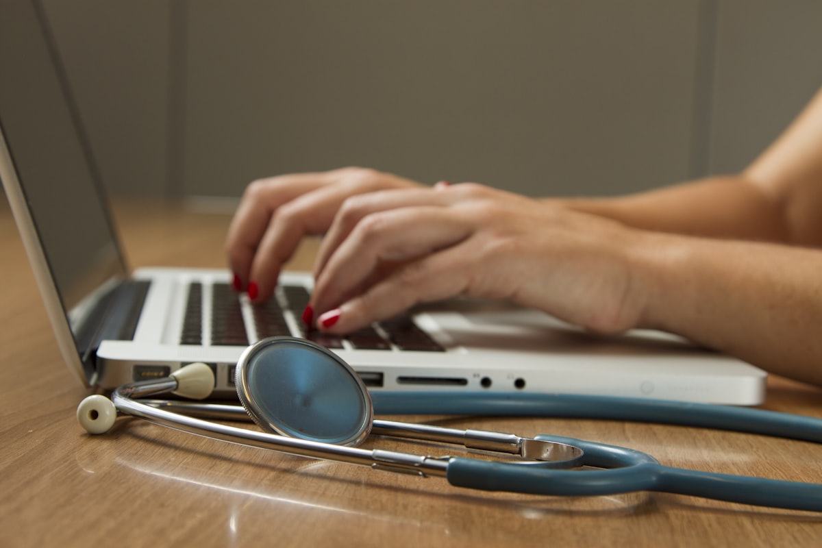 Clinician reviewing patient notes for medication management